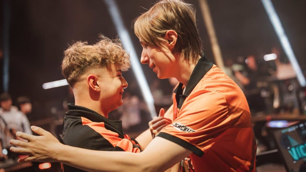 kaajak (L) and Chronicle of Fnatic react onstage after their victory against DRX